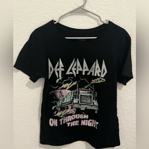 This is Thrifted Tee In good Condition. It is Back and a is a bit oversized.